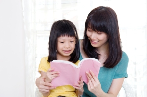 reading to kid, asian